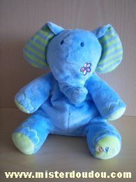 Eléphant Bleu oreilles rayées bleu et vert , fleur sur la joue et dans le dos Bruin
