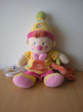 Doudou Clown Nicotoy Jaune rose orange avec anneau hochet fleur mirroir Très bon état général mais miroir fleur un peu rayé

pouet dans le ventre