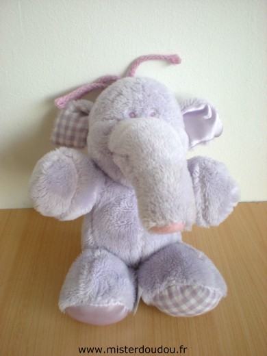 Doudou Eléphant Nicotoy Lumpy mauve avec tissus vivhy mauve sous une patte et dans l'oreille 