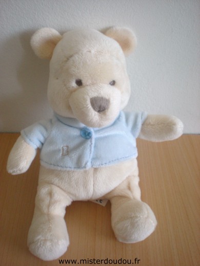 Doudou Ours Disney Winnie ecru avec gilet bleu 