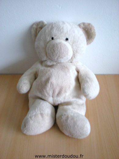 Doudou Ours Nicotoy Ecru rond beige Les oreilles sont usées